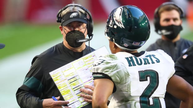 Eagles coach Doug Pederson on the sideline with Jalen Hurts